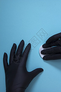 手戴黑色硝酸胶手套蓝色医疗白色药品棉绒橡皮展示外科安全保健图片