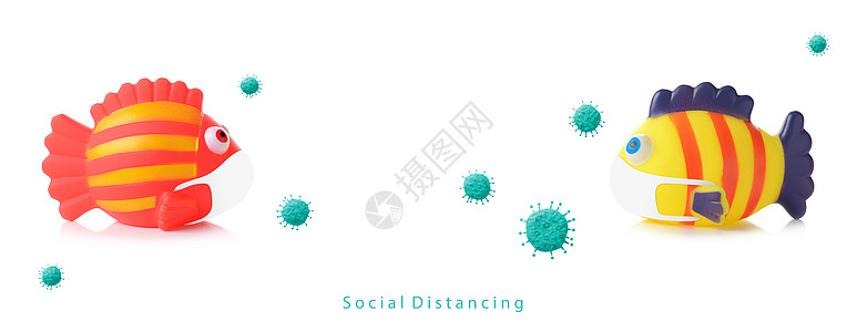戴面罩并产生冠状病毒效应的有色橡胶鱼浴玩具图片