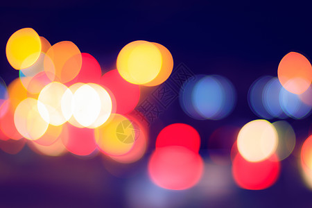 柔纱帘夜市的汽车灯和灯笼灯光闪烁 抽象布基城市景观头灯街道圆圈交通夜生活运输场景路灯背景
