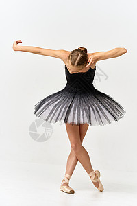Ballerina用指尖鞋 和在孤立的背景下跳舞的芭蕾舞图片