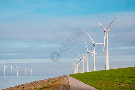用于电力生产的风车荷兰弗莱福兰 海上风力涡轮机农场 生产绿色能源的风车农场技术生态力量植物发电机螺旋桨蓝色海洋旋转全球图片