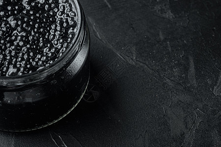 黑鱼子酱罐 黑色背景 复制文本空间文字海鲜纹理胡索白鲸美味玻璃图片