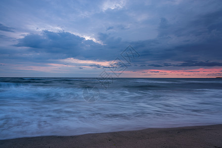 狂风大海日落与破碎的波浪天堂全景假期热带橙子蓝色阳光海岸旅行海洋图片