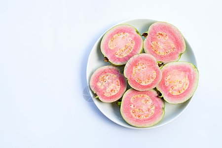 白色背景上的粉红瓜瓦异国食物情调维生素水果饮食种子营养热带篮子图片