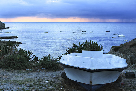 日出在西班牙南部的海滩上太阳假期海洋天气季节晴天蓝色渔村旅行天空图片
