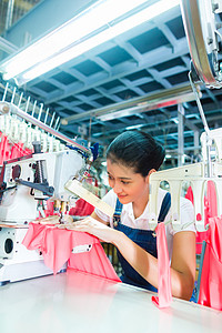印度尼西亚亚洲纺织厂的服装裁缝公司织物生产女士工人劳动机器工业体积职业下水道图片