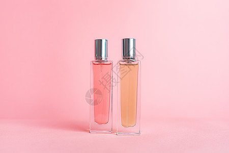 粉红色背景上的香水瓶 芳香疗法 香水的味道 香精的选择 粉红色的背景香味浪漫小样产品化妆品瓶子奢华卫生香气女士图片