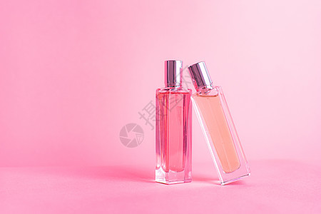 粉红色背景上的香水瓶 芳香疗法 香水的味道 香精的选择 粉红色的背景液体魅力香气阴影小样产品卫生女性玻璃香味图片