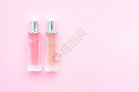 粉红色背景上的香水瓶 芳香疗法 香水的味道 香精的选择 粉红色的背景液体女士香味阴影产品女性卫生温泉香气瓶子图片
