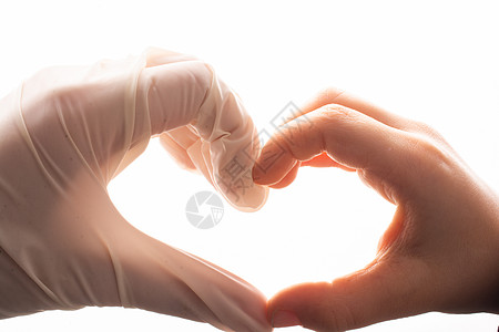 双手上戴上乳胶手套 以保护心脏的形状手术职员外科卫生传染性病人实验室流感橡皮医生图片