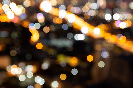 模糊的散景背景与暮光之城的城市景观晚上模糊的焦点与市中心的景观照明和光线商业天际天线圆形旅行耀斑建筑摩天大楼建筑物水平图片