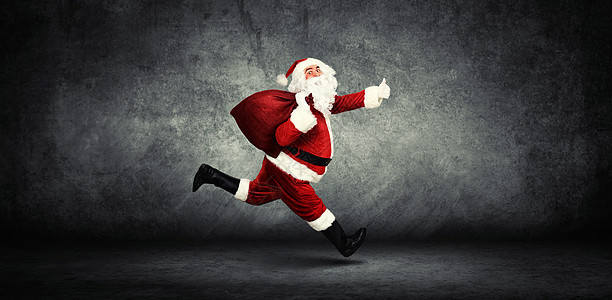 圣诞老人 带着一袋礼物幸福季节微笑传统魔法假期惊喜庆典戏服喜悦图片
