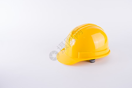 在白色背景的黄色安全帽 在白色隔绝的安全帽 安全设备概念 工人和工业主题塑料制造业工作生产生活工具商业男性建设者危险图片
