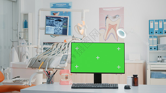 没有任何牙医办公室在计算机上水平绿色屏幕的用户图片