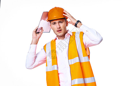 橙色建筑身穿橙色制服的男子工人装作建筑工程师橙子建筑师男人经理安全帽项目成人人士承包商背景