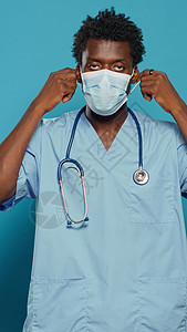 身戴面罩以防范冠状病毒的护工口罩蓝色药品医院护士黑色工作专家面具医师图片