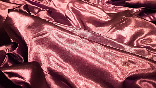 紫色织物特写背景 光滑优雅的丝绸或缎子质地可以用作背景 抽象布织物 织物背景编织装饰海浪天鹅绒亚麻折叠涟漪材料曲线风格床单图片