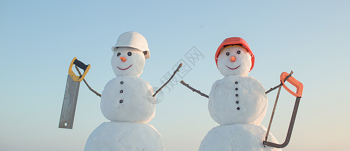 冬天的雪人建筑工 戴头盔 圣诞雪人 建筑和维修工程背景图片