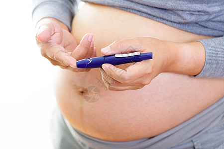 患有糖尿病的孕妇控制女士医生测试母亲手指肚子工具葡萄糖治疗图片
