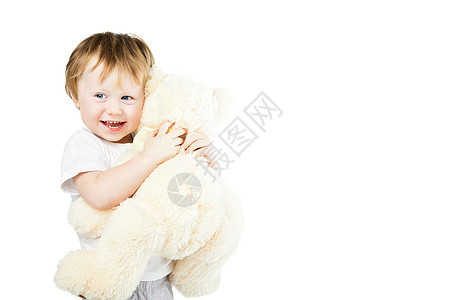 带大玩具熊的小女婴 可爱又可爱又滑稽的婴儿幸福女性女孩微笑玩具孩子动物乐趣快乐柔软度图片