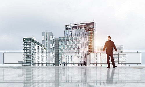 日升在摩天大楼之上 商务人士面对新的一天办公室工作经理城市创造力人士男人金融商务商业图片