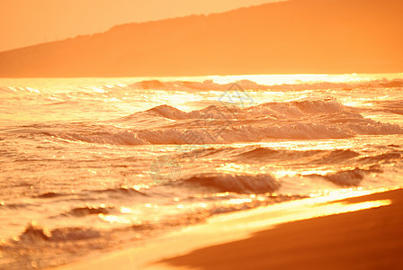 海上日落海洋海岸地平线旅行紫色阳光反射蓝色天空金子图片