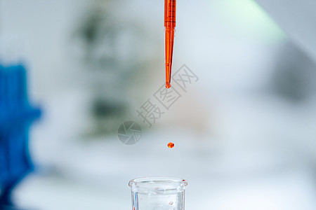 一滴红液在实验室的烟囱里的背景图象 里面有一片红色液体测试试管反射细菌免疫抗体吸管烧瓶职业临床图片
