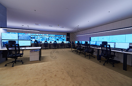 大型现代安保系统控制室的空内置安全系统控制室电脑服务监督电话桌子中心控制板工作机构椅子图片