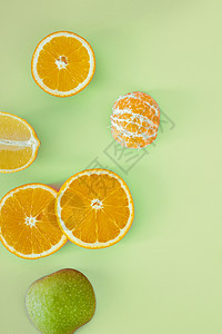 具有复制空间的新鲜热带水果粉红背景橙子健康饮食柠檬食物高架卡片营养绿色桌子图片