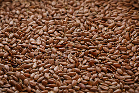 深褐色麻痹种子的背景纹理纤维框架农业营养食物谷物宏观饮食脂肪粮食图片
