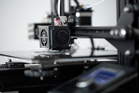 实验室的3D印刷机操作 由3D打印机负责电脑腹肌商业印刷打印聚合物灯丝软件工程生产背景图片