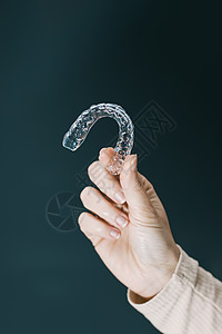 持有透明的手持预留器支撑牙齿医疗牙医塑料固定器病人美白警卫白色图片