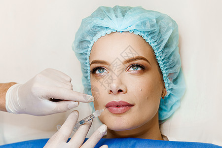 整形外科医生确实在诊所的嘴唇上注射过 化妆性美容面部治疗也进行过人工复健手术手套程序皮肤女孩化妆品皱纹塑料注射器药品女性图片