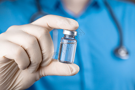 医生持有抗冠状病毒疫苗的毒物免疫医院科学疫苗安瓿剂量药品糖尿病健康注射器图片
