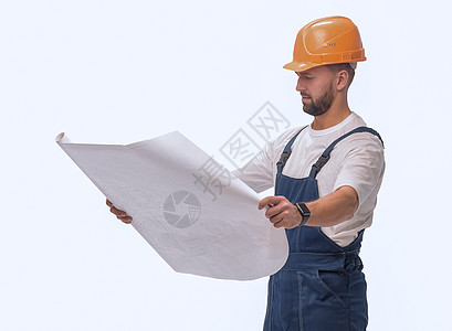 能够胜任的工头建筑设计器 查看绘图 孤立于白色服务图纸男人修理工安全帽子职业工程师员工建设者图片