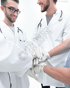 一群医生 他们用手捆在一起女性保健男人药品健康合伙合作会议专业人员团队图片