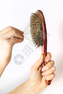 梳子上有很多毛 有选择的焦点卫生保健木头工具压力刷子药品女士秃头损失图片