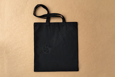 蜜蜂背景平地上黑纺织购物袋营销市场店铺手提袋商业购物棉布褐色帆布配饰图片