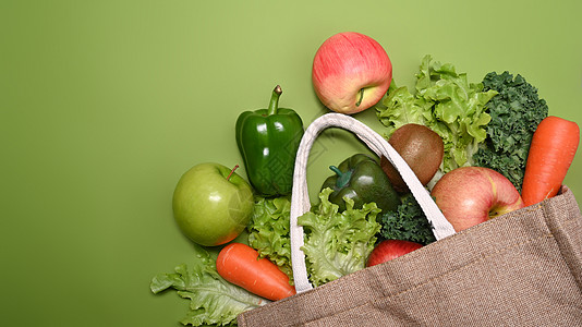 绿色背景的生态袋 上面有各种有机蔬菜和水果 各种生菜图片