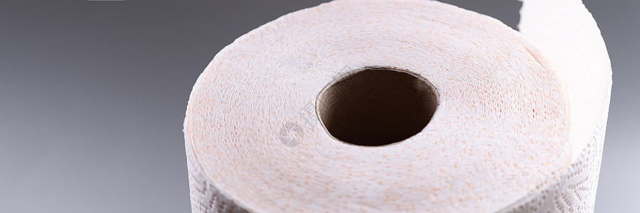 灰色背景的卫生纸卷排便设施厕所产品家庭床单吸水性清洁工卫生组织图片