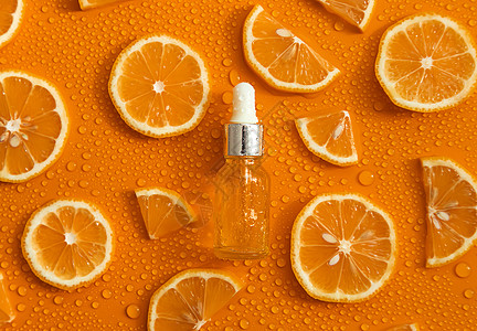 瓶装化妆品和液滴 润滑橙 高压酸 选择性焦点橙子科学产品治疗液体润肤香气护理生物皮肤图片