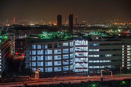 从川川县川川卡瓦萨基市看到Keihin工业区建筑群工厂夜空路灯组合器城市港口管道植物景观图片