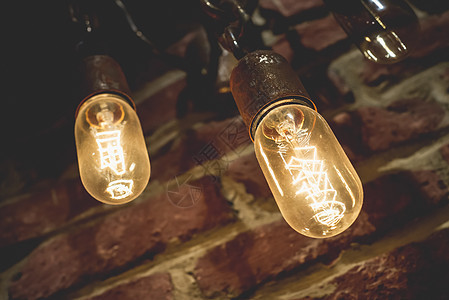 Tungsten灯 旧时尚吊灯玻璃灯泡解决方案活力灯光概念黄色力量创新发明图片