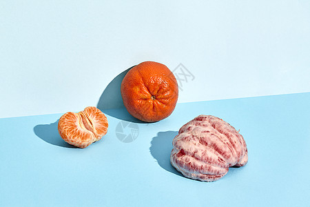 普通普通话和一半葡萄油热带柚子水果异国食物甜点蓝色饮食橙子叶子图片