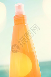 保护沙滩上的皮肤美丽洗剂阳光奶油棕褐色旅行太阳身体防晒霜塑料图片