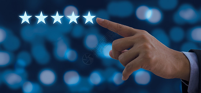 商务人士触摸五星符号的手 提高背景评分(以提升对背景的评分)图片