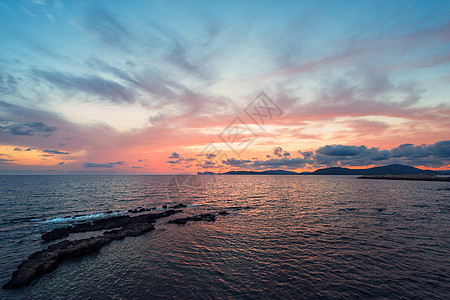 阿尔盖罗湾多彩的日落观光假期橙子旅行太阳场景海洋地平线旅游天空图片