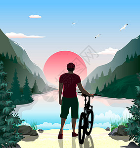 一个骑自行车的人在山湖岸边图片