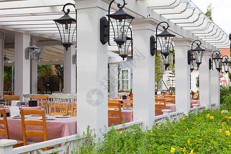 花园餐厅户外餐厅 旅行 餐巾 椅子 夏天 街道 热带背景