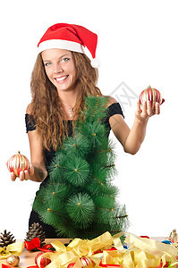 有圣诞树的年轻女子 女性 圣诞老人 快乐的 魅力 女孩 幸福图片